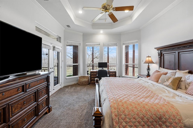 carpeted bedroom featuring ceiling fan, visible vents, access to exterior, a raised ceiling, and ornamental molding