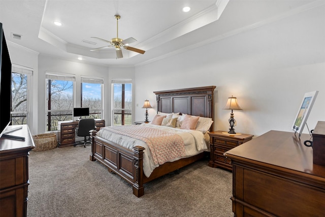 bedroom featuring crown molding, a raised ceiling, carpet flooring, and recessed lighting