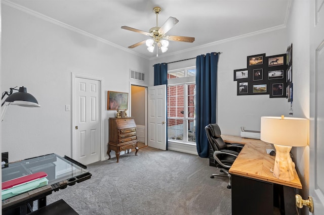 carpeted office featuring visible vents, baseboards, crown molding, and ceiling fan