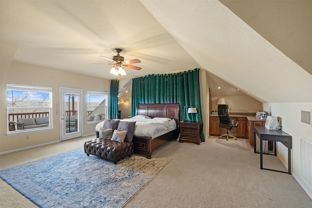 bedroom featuring light colored carpet, baseboards, vaulted ceiling, and access to exterior