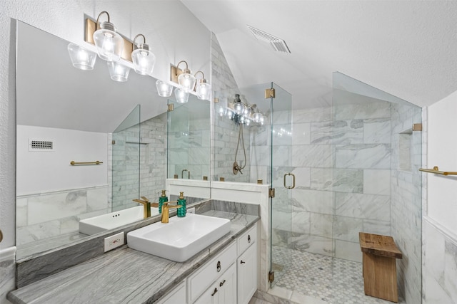 full bath featuring visible vents, a stall shower, and lofted ceiling
