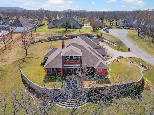 birds eye view of property with a residential view
