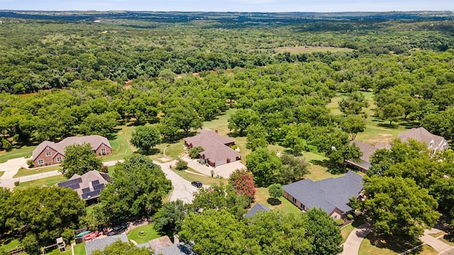 birds eye view of property with a residential view and a wooded view