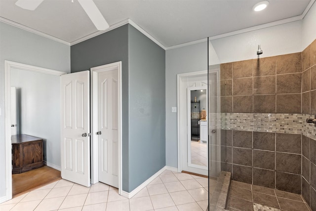 full bath featuring a walk in shower, ornamental molding, tile patterned flooring, and baseboards