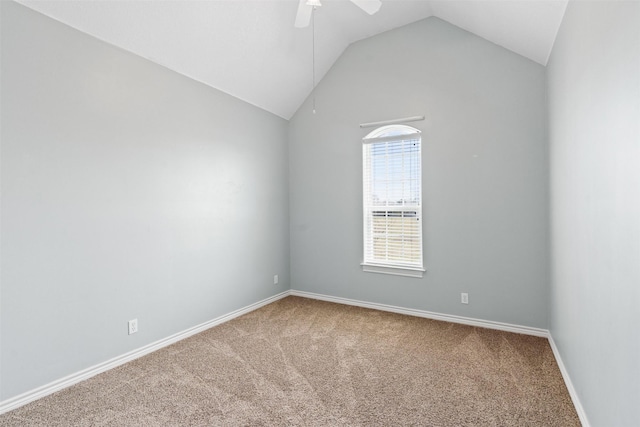 unfurnished room with vaulted ceiling, carpet flooring, a ceiling fan, and baseboards