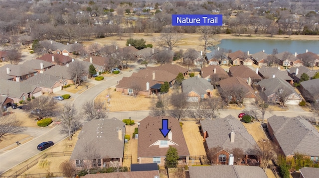 aerial view featuring a residential view and a water view