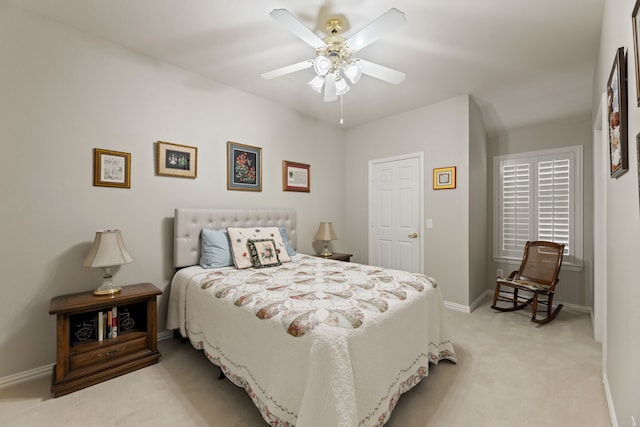 bedroom featuring light carpet, ceiling fan, and baseboards