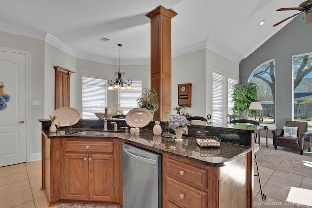 kitchen featuring light tile patterned floors, visible vents, dishwasher, a kitchen breakfast bar, and a sink