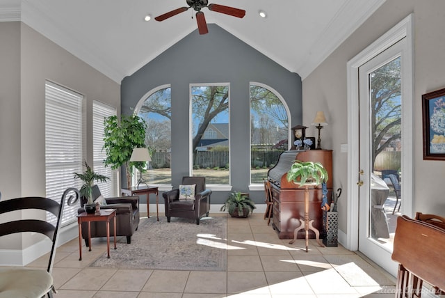 sitting room featuring light tile patterned floors, plenty of natural light, high vaulted ceiling, and ceiling fan