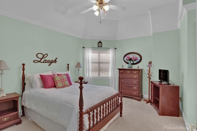 carpeted bedroom with lofted ceiling, baseboards, ornamental molding, and a ceiling fan