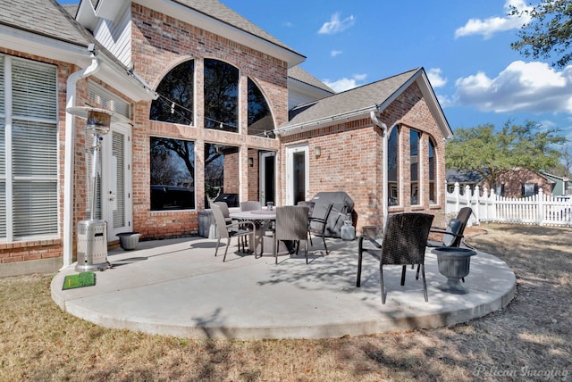 view of patio / terrace featuring fence