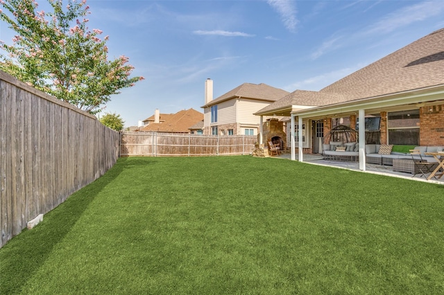 view of yard with a fenced backyard, an outdoor hangout area, and a patio