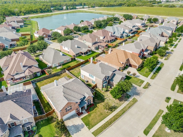 bird's eye view with a water view and a residential view