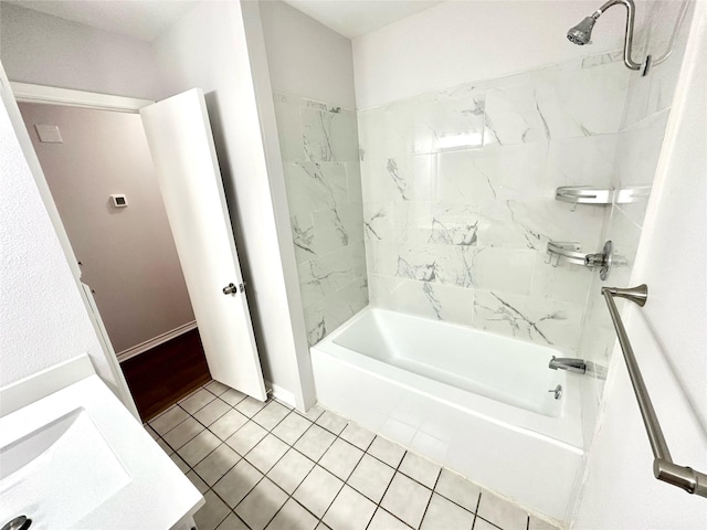 full bathroom featuring tile patterned flooring, bathtub / shower combination, baseboards, and vanity