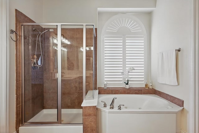 full bathroom featuring a stall shower and a whirlpool tub