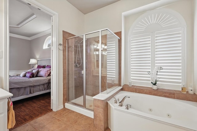 ensuite bathroom featuring tile patterned floors, ensuite bath, a tub with jets, and a shower stall