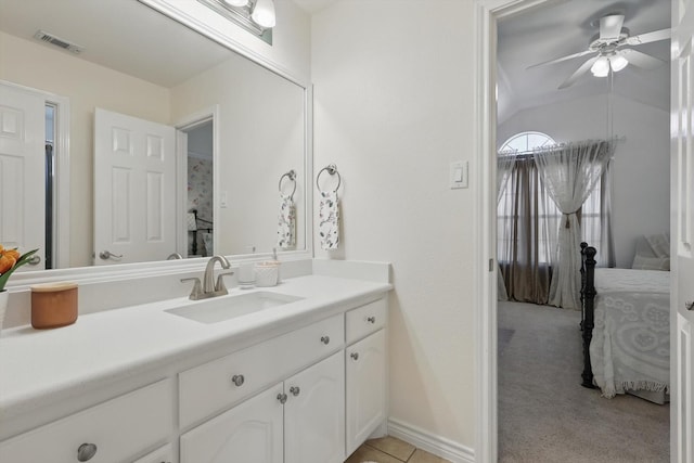 bathroom with visible vents, a ceiling fan, connected bathroom, lofted ceiling, and vanity