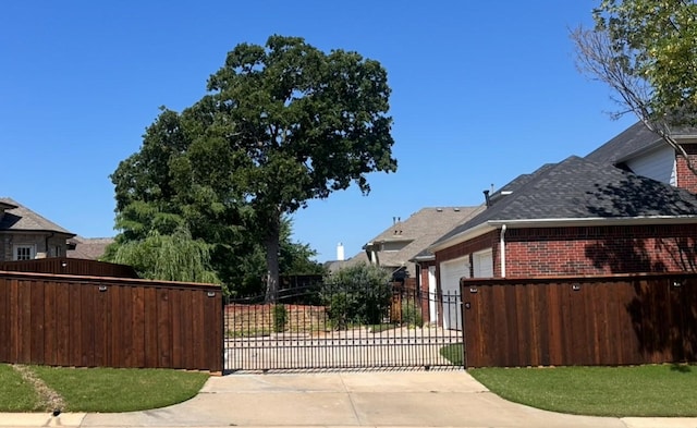 view of gate featuring fence