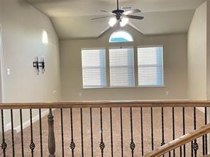 hallway with vaulted ceiling