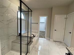 bathroom featuring a soaking tub and a shower stall