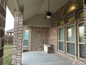 view of patio / terrace featuring ceiling fan and fence