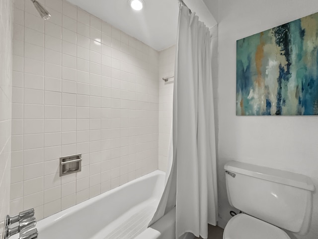 bathroom with toilet and shower / bath combo with shower curtain