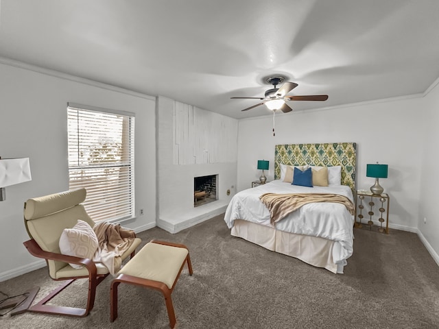 bedroom featuring a large fireplace, carpet flooring, a ceiling fan, and baseboards