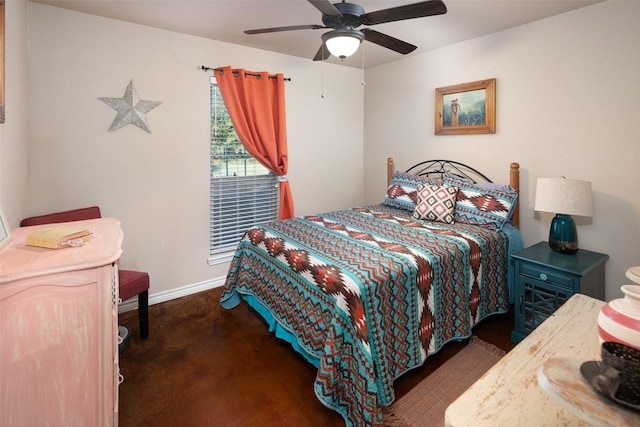 bedroom with a ceiling fan and baseboards