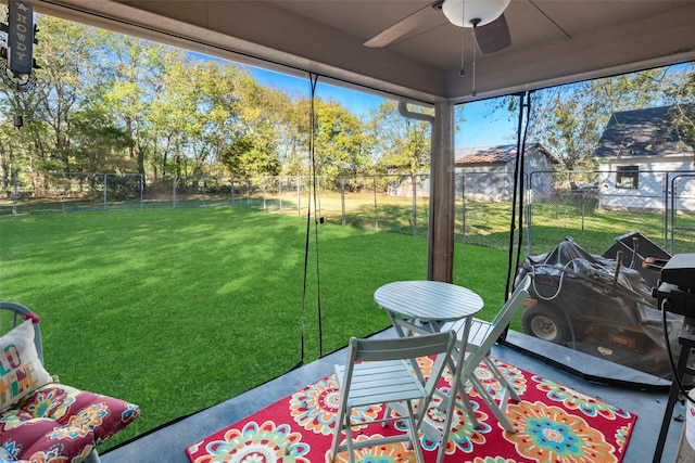 sunroom / solarium with ceiling fan