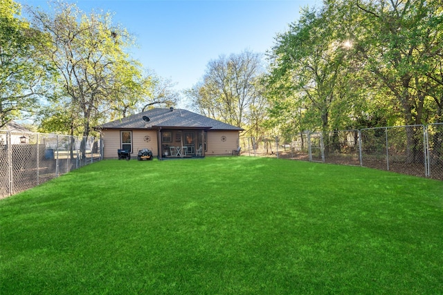 view of yard with a fenced backyard