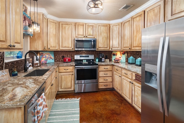 kitchen featuring visible vents, decorative backsplash, appliances with stainless steel finishes, a sink, and light stone countertops