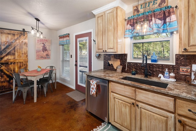 kitchen featuring backsplash, stainless steel dishwasher, a barn door, light brown cabinets, and a sink