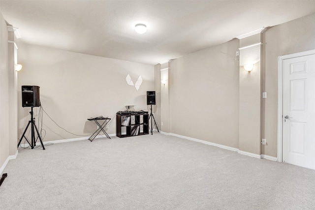 carpeted empty room featuring baseboards