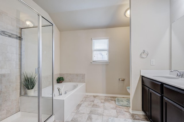 bathroom featuring baseboards, toilet, a garden tub, a stall shower, and vanity