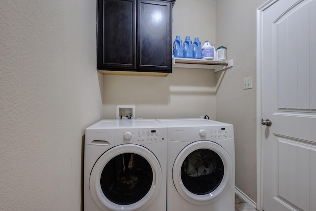 laundry area featuring cabinet space and washer and dryer