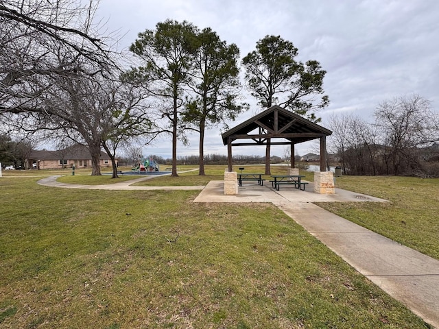 surrounding community featuring a gazebo, playground community, and a yard