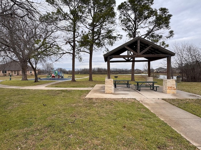 view of community with a gazebo, a yard, and playground community