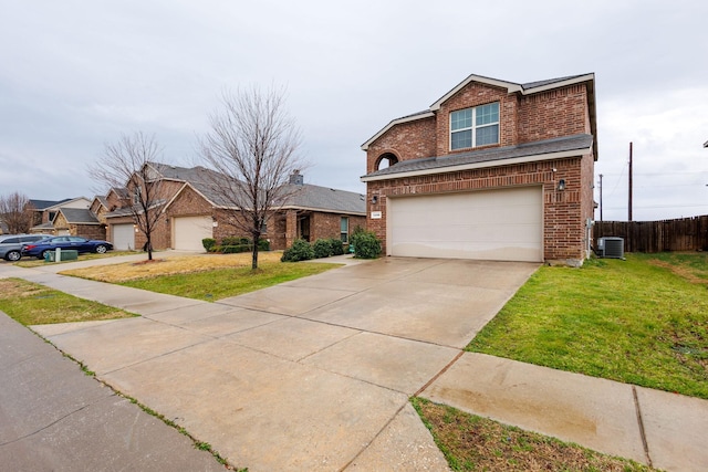 traditional-style home with a front yard, cooling unit, fence, concrete driveway, and brick siding