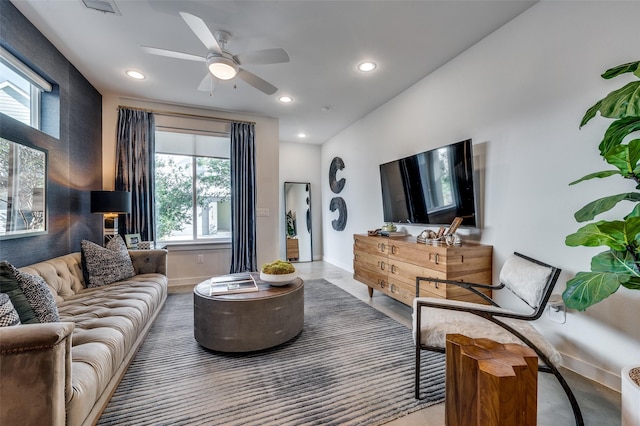 living room with ceiling fan, baseboards, and recessed lighting