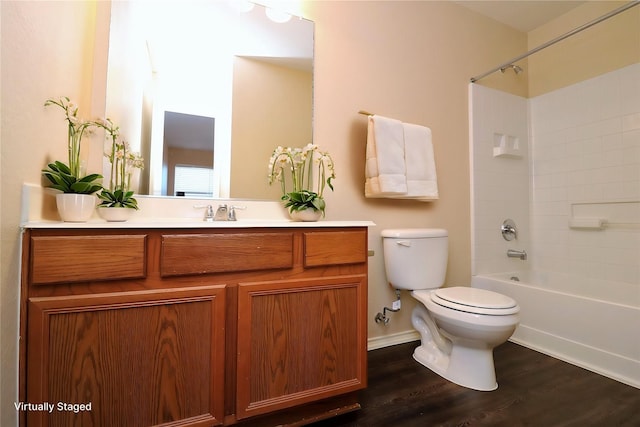 bathroom featuring tub / shower combination, vanity, toilet, and wood finished floors