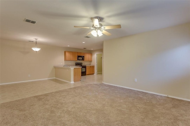 unfurnished living room with light carpet, baseboards, visible vents, and a ceiling fan