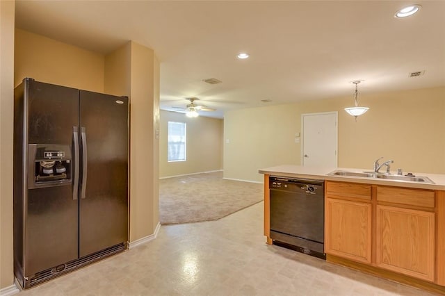 kitchen with visible vents, a ceiling fan, light countertops, black appliances, and a sink