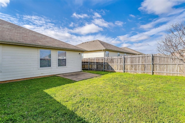 view of yard with fence and a patio