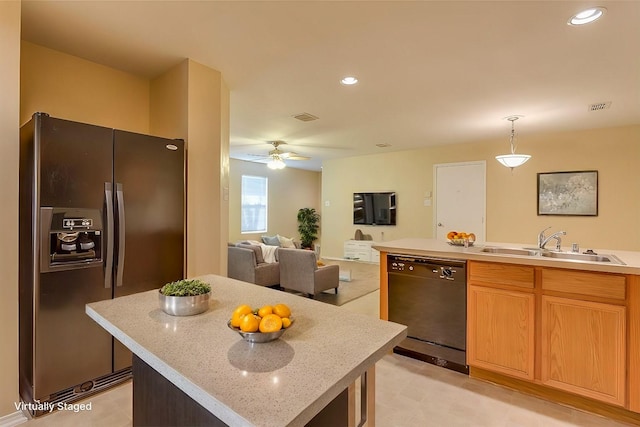 kitchen featuring a sink, visible vents, light countertops, fridge with ice dispenser, and dishwasher