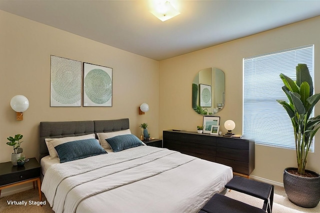 bedroom featuring carpet floors and baseboards