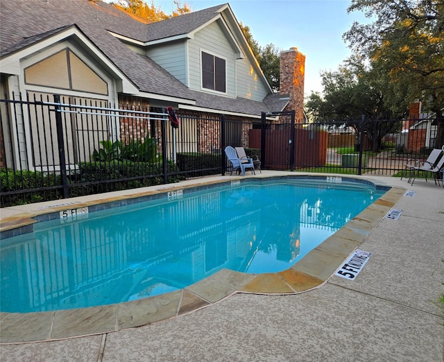 community pool featuring fence