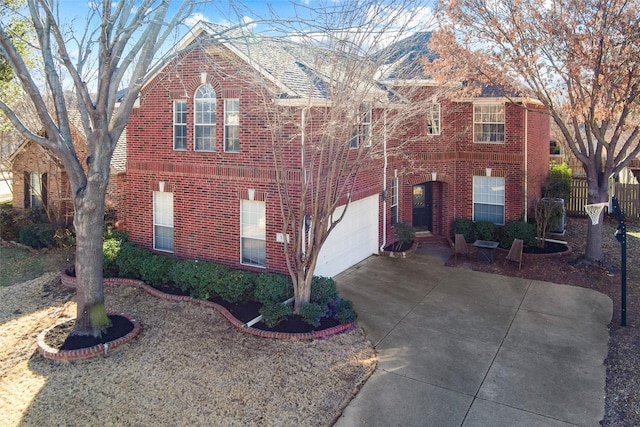 view of front of house with brick siding, driveway, and an attached garage