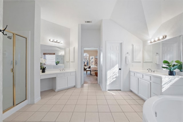 ensuite bathroom featuring ensuite bathroom, a sink, visible vents, vaulted ceiling, and a stall shower