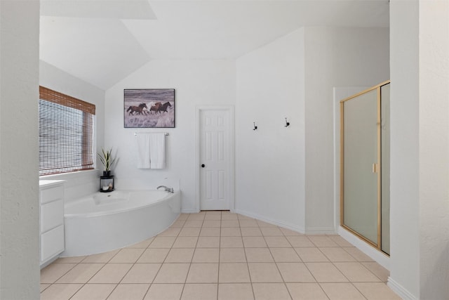 full bathroom with vaulted ceiling, a shower stall, tile patterned flooring, baseboards, and a bath