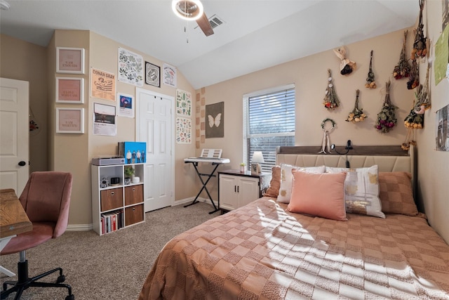 carpeted bedroom featuring lofted ceiling, visible vents, and baseboards